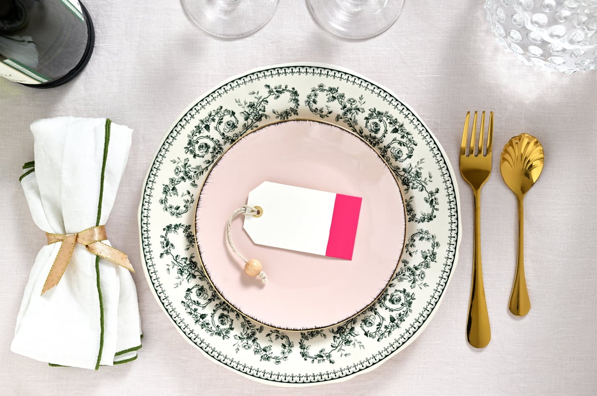 A refined table setting with French porcelain and place cards