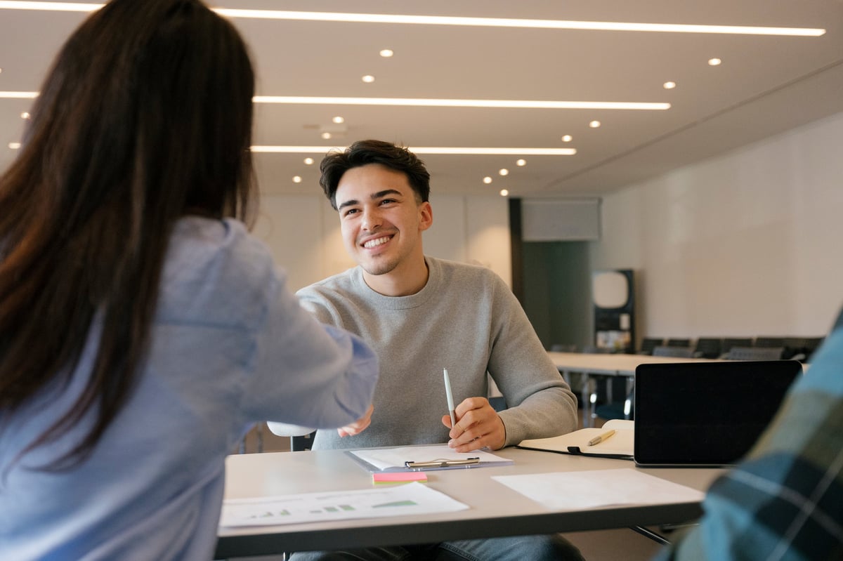 A young professional shaking hands during a meeting